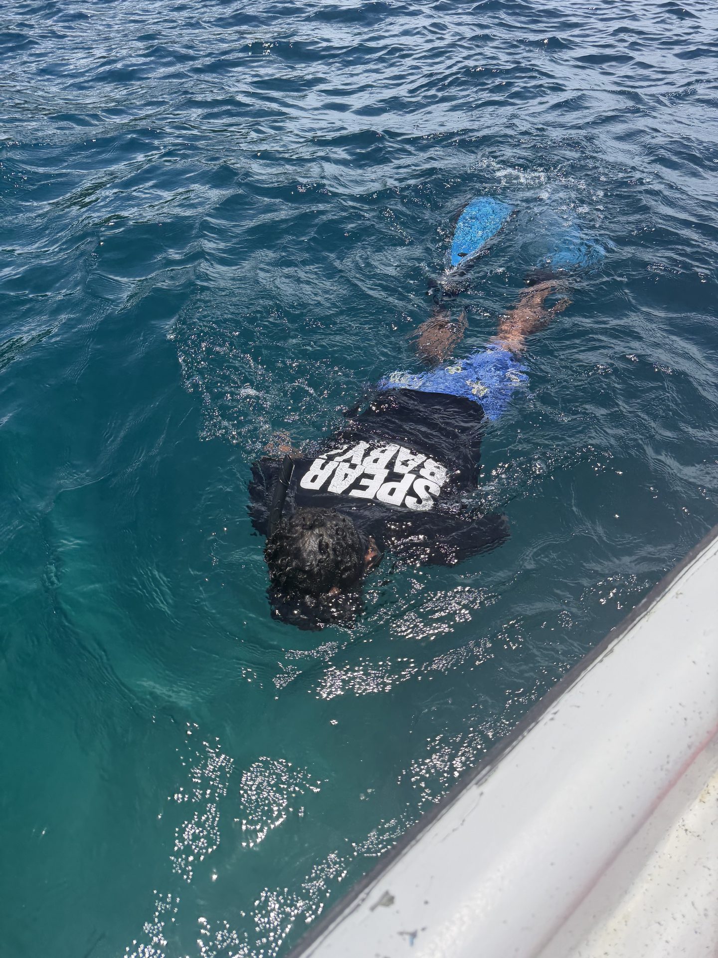 Alberto driving the boat at sunset near Santa Catalina