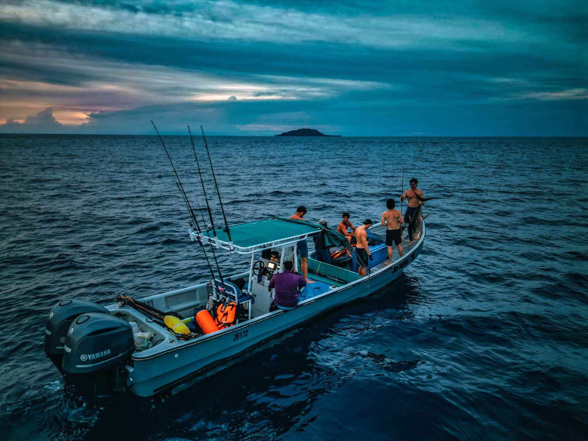 Spearbaby crew on fishing boat at dawn in Pacific Panama