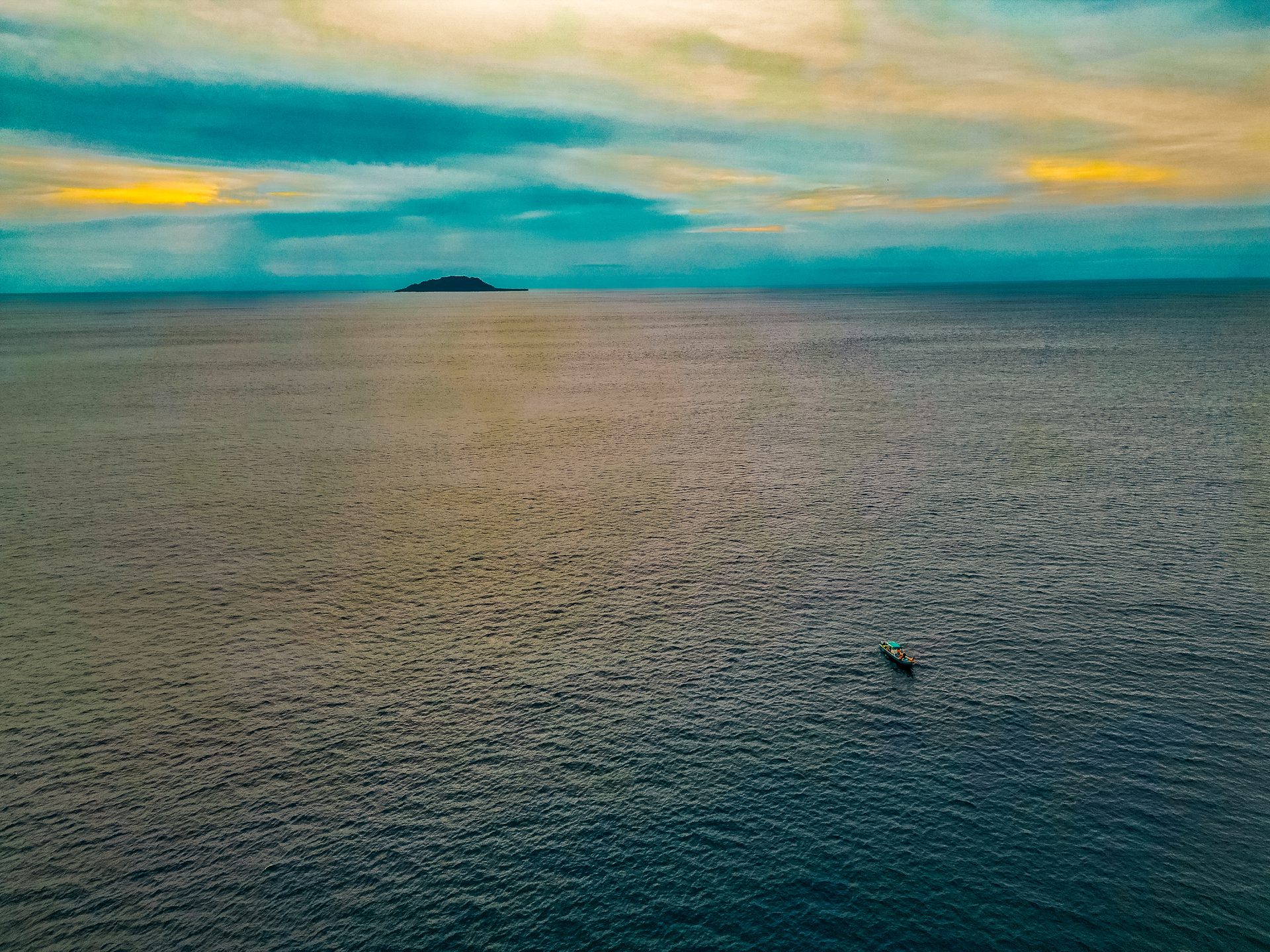 Spearbaby fishing boat at sunset in Pacific Ocean